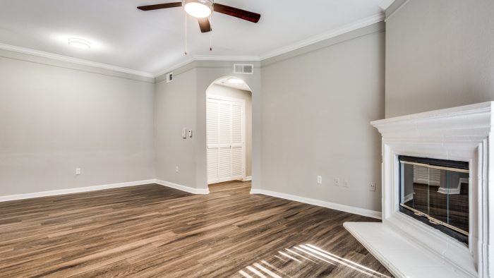 empty room with hardwood floors and ceiling fan at The  Vincent