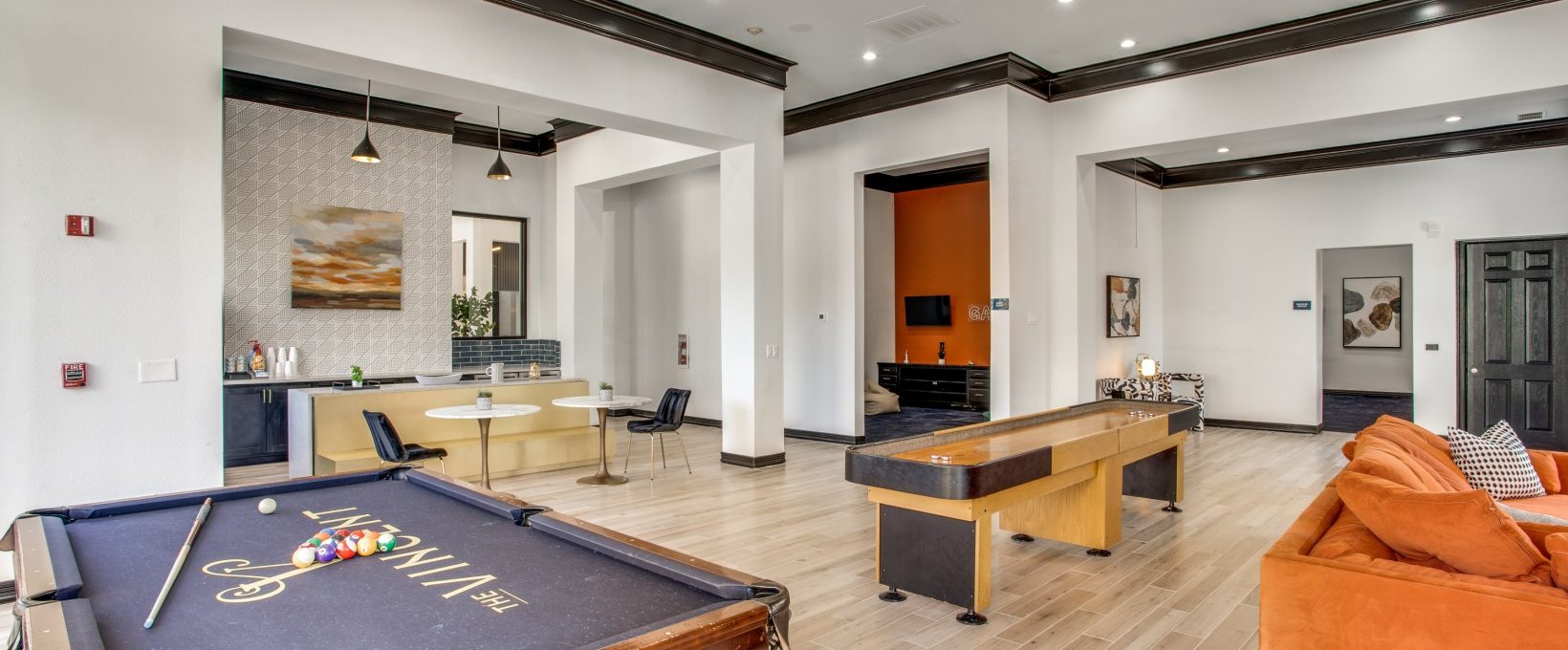 a pool table and billiard table in a living room at The  Vincent