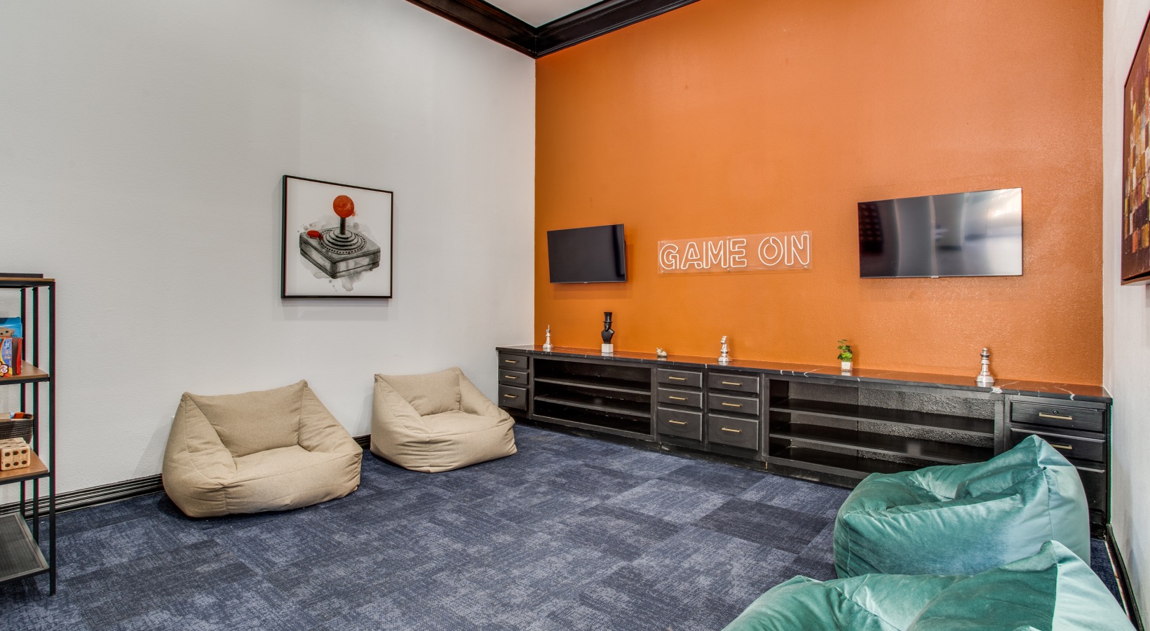 a room with orange walls and blue bean bags at The  Vincent